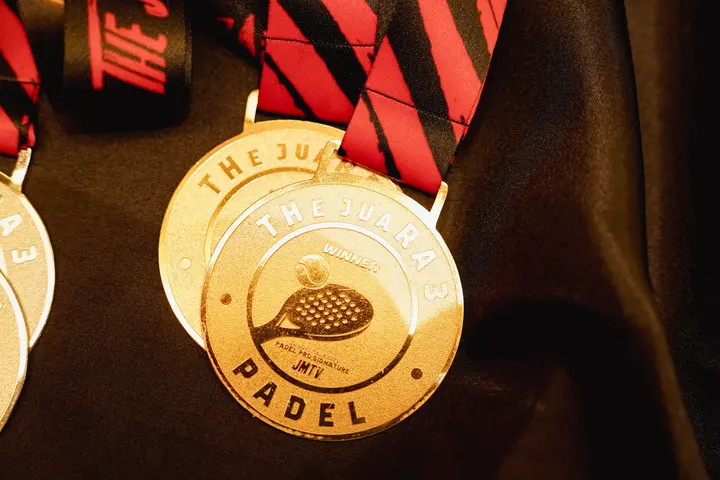 Gold medal with red-black ribbon