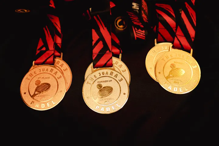Medals lined up under warm light